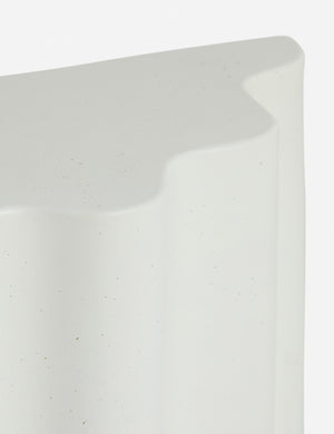 Close up of the Lune half-moon, scalloped concrete side table