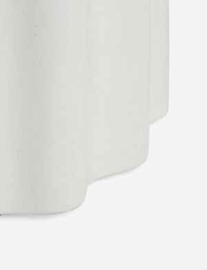 Close up of the Lune half-moon, scalloped concrete side table
