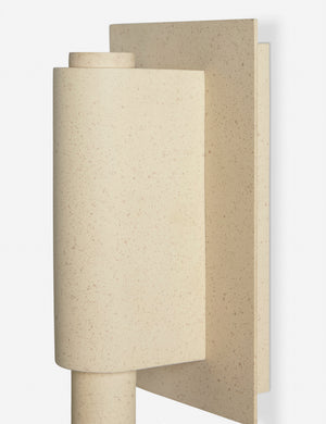 Close up of the Noor sculptural, wavy swing arm wall sconce