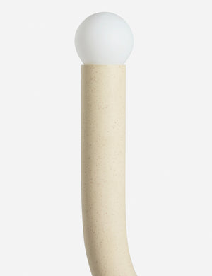 Close up view of the Noor sculptural, wavy swing arm wall sconce
