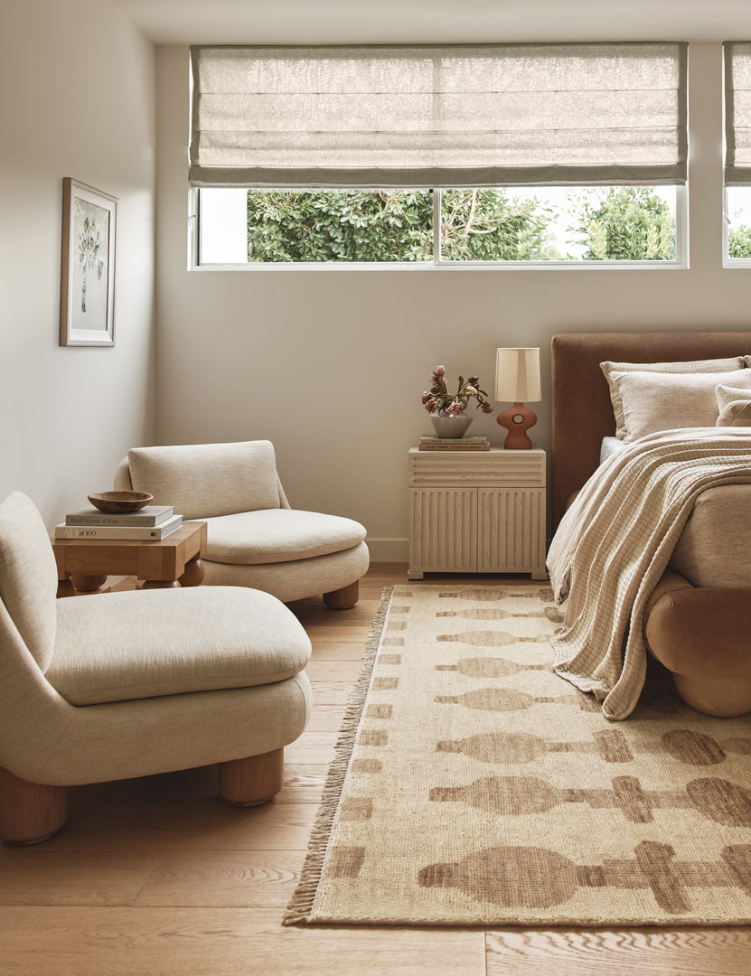 #color::terracotta | A bedroom featuring the Rhodes sculptural ceramic table lamp on a nighstand.