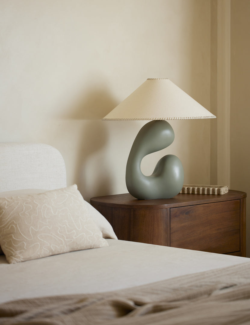 #color::sage | Saguaro Sculptural Ceramic Table Lamp by Elan Byrd styled on a bedside table.