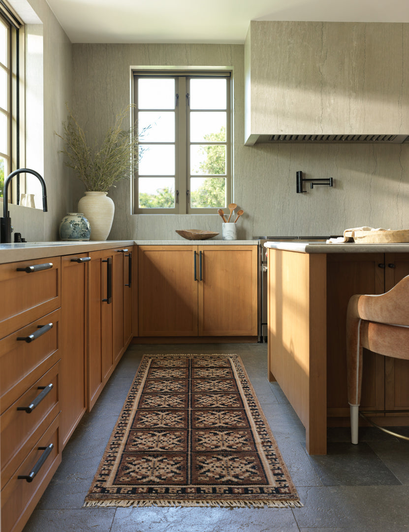 #color::taupe #size::2-6--x-8--runner | Ovidi heritage motif hand-knotted wool runner rug styled in a kitchen.
