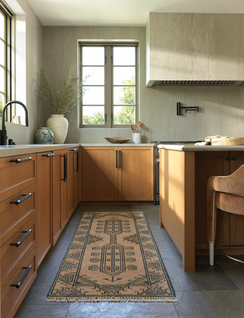 #color::taupe #size::2-6--x-8--runner | The Vishal geometric motif hand-knotted wool runner rug styled in a kitchen.