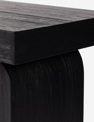 Mags sculptural solid wood desk in black.
