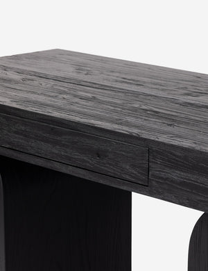 Mags sculptural solid wood desk in black.