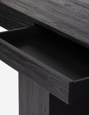 Mags sculptural solid wood desk in black.