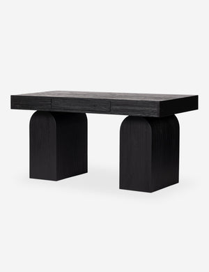 Mags sculptural solid wood desk in black.