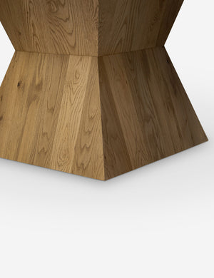 Close up of the base of the Hermoza sculptural round pedestal extendable dining table.