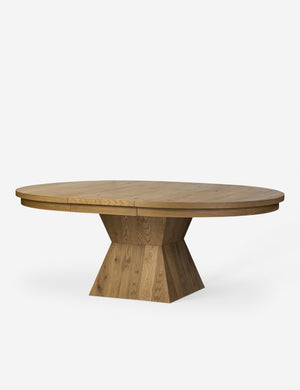 Hermoza sculptural round pedestal extendable dining table.
