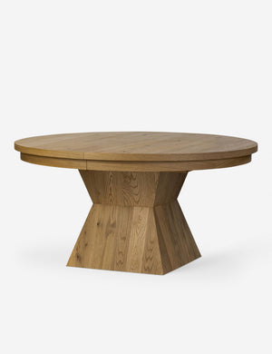 Hermoza sculptural round pedestal extendable dining table.