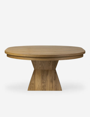 Side profile of the Hermoza sculptural round pedestal extendable dining table.