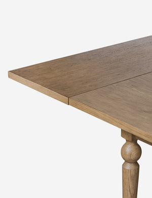 Close up of the corner of the Friese oak extendable dining table.
