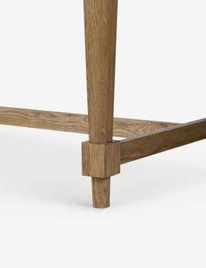 Close up of the leg of the Friese oak extendable dining table.