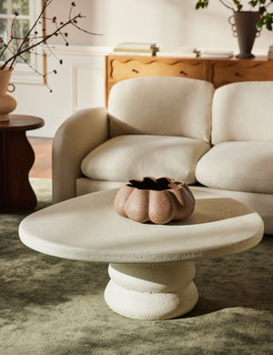 Hannu modern round fibercement coffee table by Aimee Song in a living room