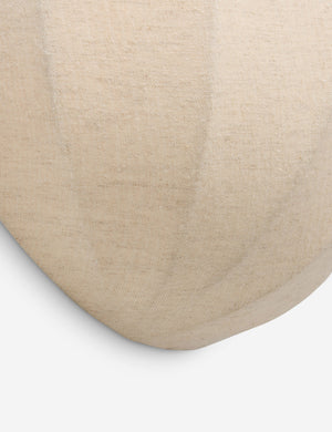 Close up of the Mahan linen up-ight wall sconce