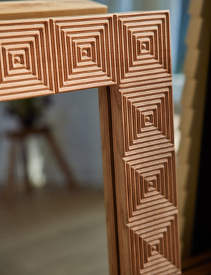 Corner of the Chelan handcrafted carved wood frame mirror.