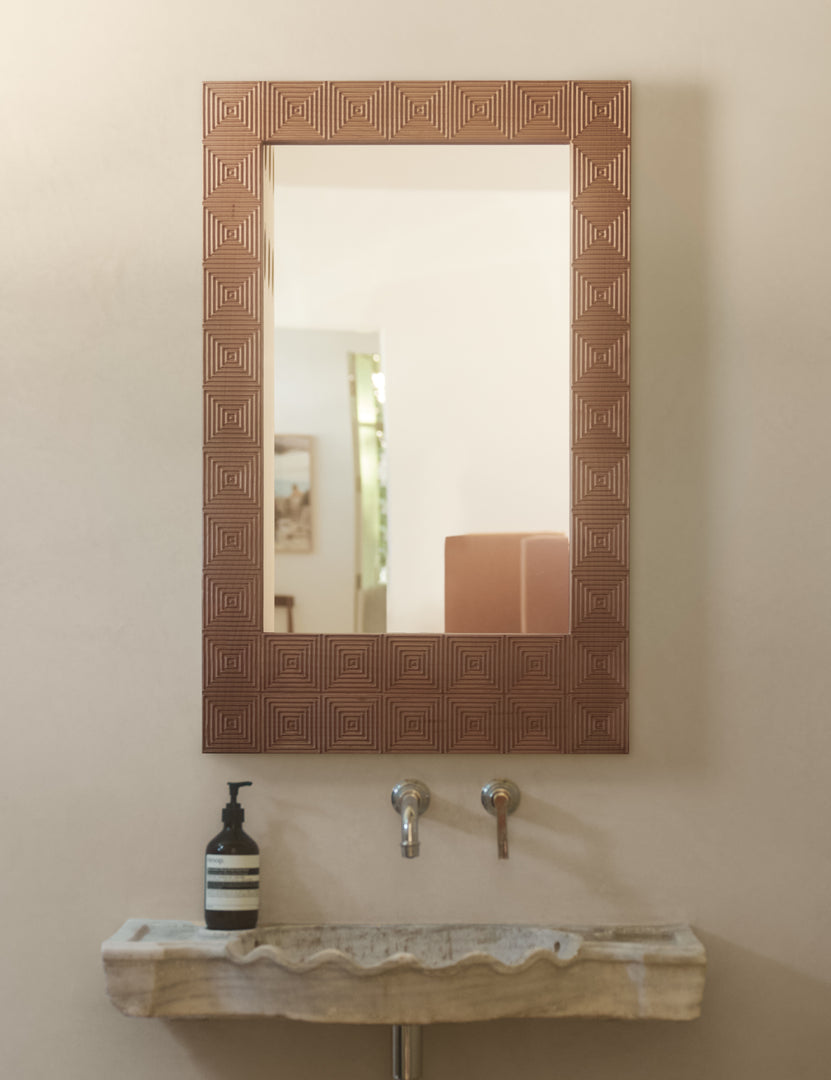 #color::natural | Chelan handcrafted carved wood frame mirror hanging above a bathroom sink.