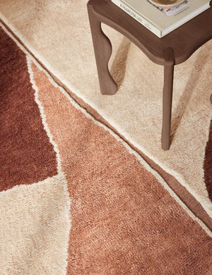 Close up view of the Amalfi Modern Organic Hand-Knotted Wool Rug by Aimee Song under a side table