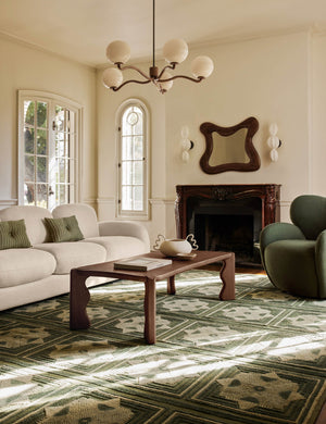 Living room featuring the Grifo wavy sculptural oak coffee table by Aimee Song