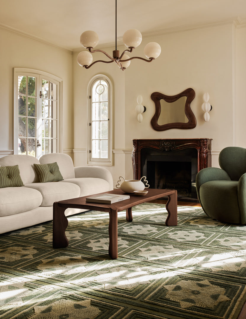 #color::natural  Cambria chunky wood frame wavy silhouette mirror by Aimee Song hung over a mantel in a living room