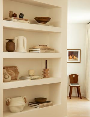 Melona resin decorative tray styled on a built in bookshelf.