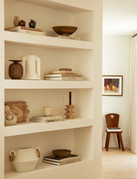 #color::travertine | Melona resin decorative tray styled on a built in bookshelf.