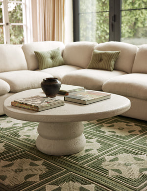 Hannu modern round fibercement coffee table by Aimee Song in a living room