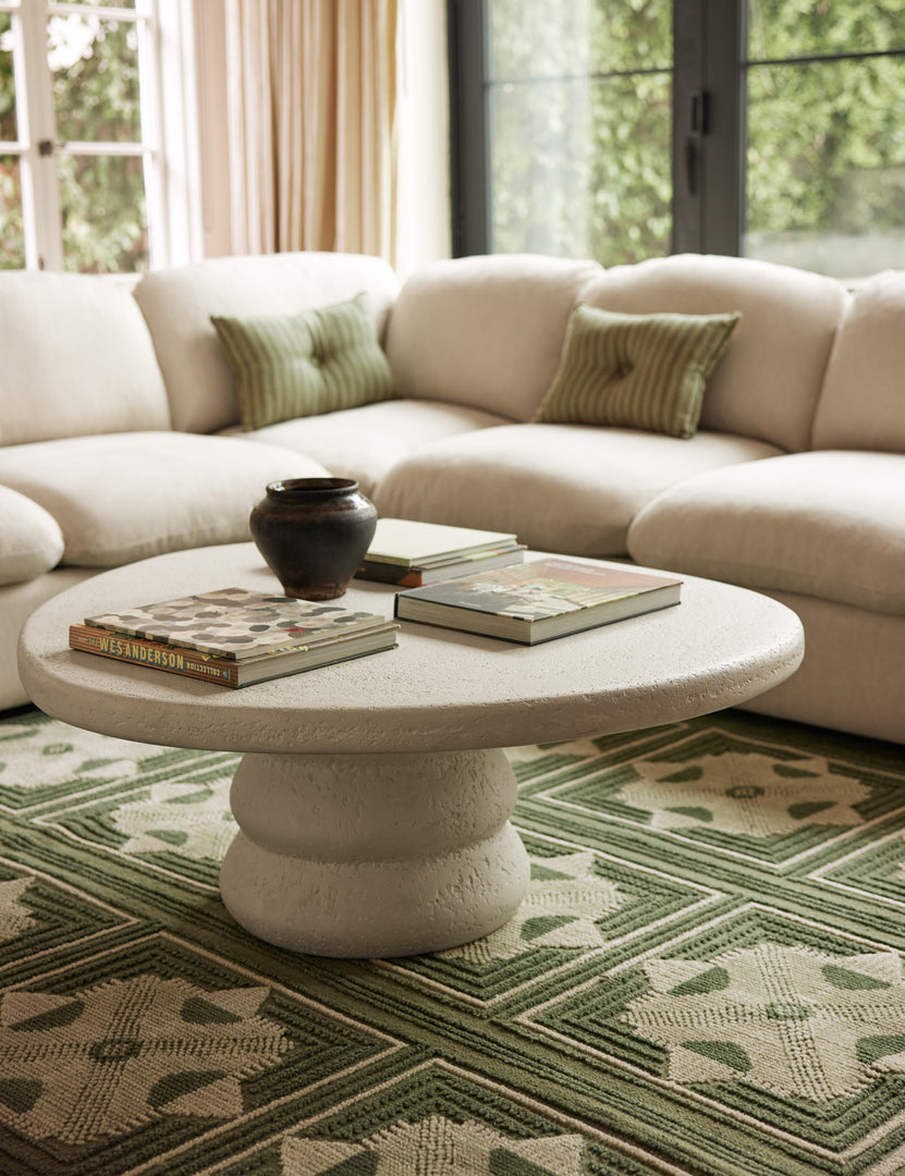 #color::ivory | Hannu modern round fibercement coffee table by Aimee Song in a living room