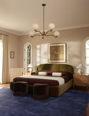 Two Brahm sculptural velvet fringe accent stool by Aimee Song styled at the foot of a bed in a bedroom