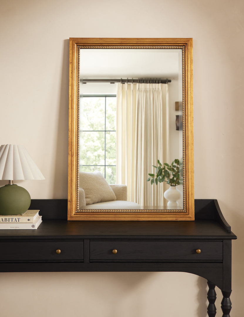 #color::gold | Corinne textural gold epoxy resin frame wall mirror styled on a black console table.