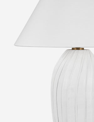 Close up of the Pama sculptural, pleated-detail ceramic table lamp