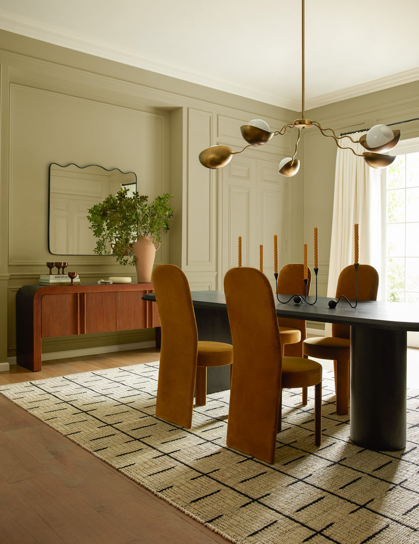 #color::sienna-velvet | Four Halbrook upholstered tall back sculptural dining chairs in sienna velvet around a dining table