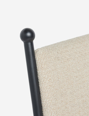 Close up of the Fidia curved metal silhouette dining chair by Aimee Song