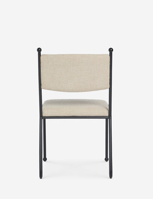 Back view of the Fidia curved metal silhouette dining chair by Aimee Song