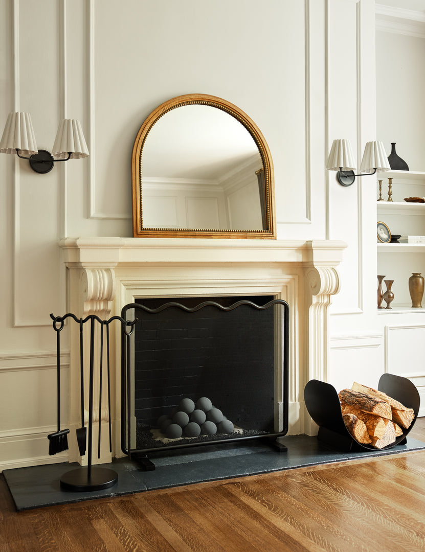 #color::gold | Corinne textural gold epoxy resin frame mantel mirror hanging above a fireplace.