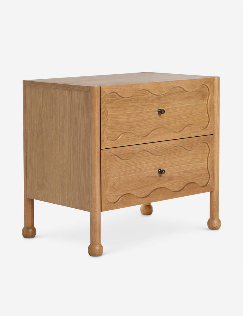 #color::natural | Angled view of the Fontaine wavy detailing solid oak 2-drawer nightstand by Aimee Song