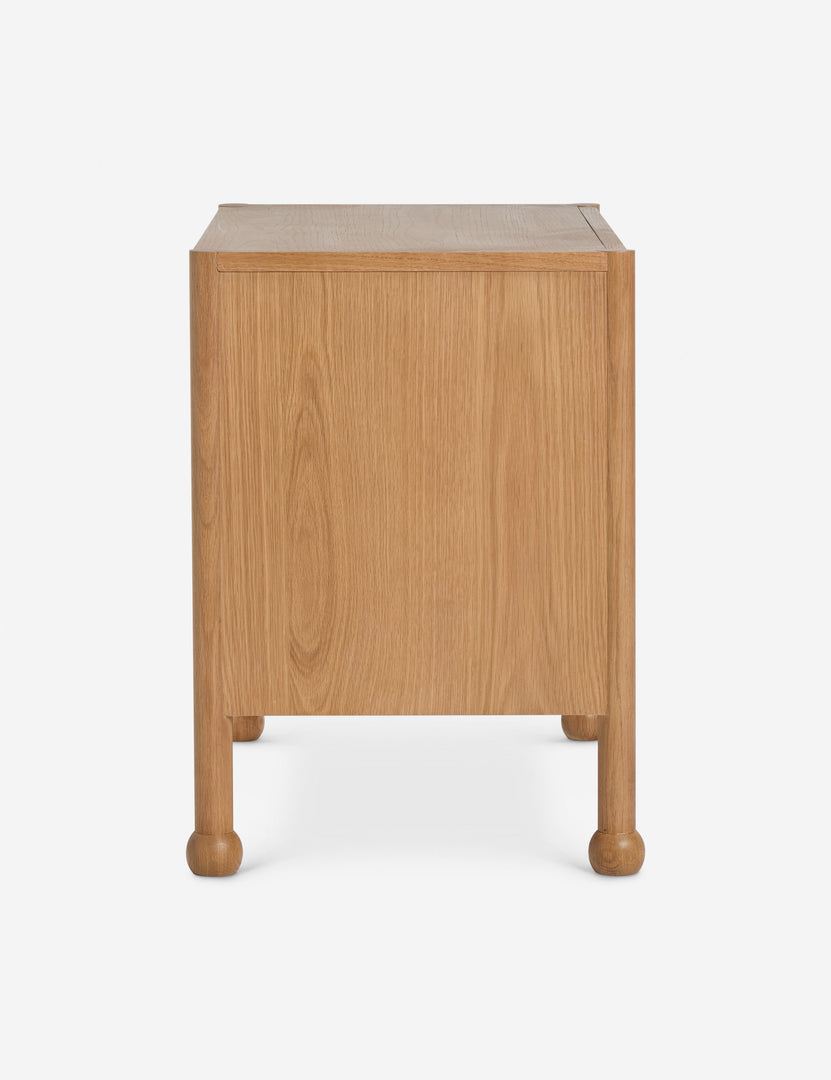 #color::natural | Side profile view of the Fontaine wavy detailing solid oak 2-drawer nightstand by Aimee Song