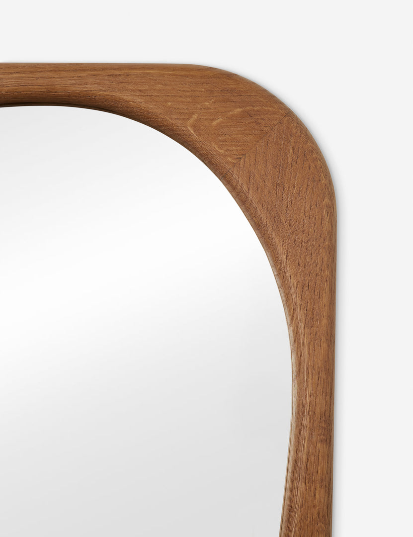 #color::natural | Close up view of the frame of the Galilea solid wavy wood frame mirror mirror by Aimee Song