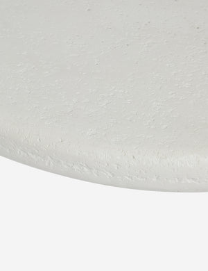 Close up view of the Hannu modern round fibercement coffee table by Aimee Song