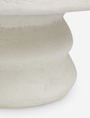 Close up view of the Hannu modern round fibercement coffee table by Aimee Song