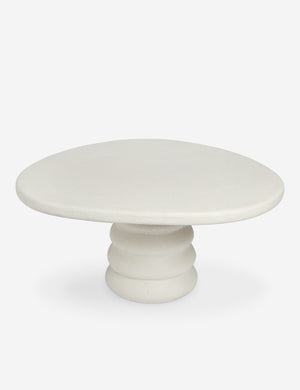 Angled overhead view of the Hannu modern round fibercement dining table by Aimee Song