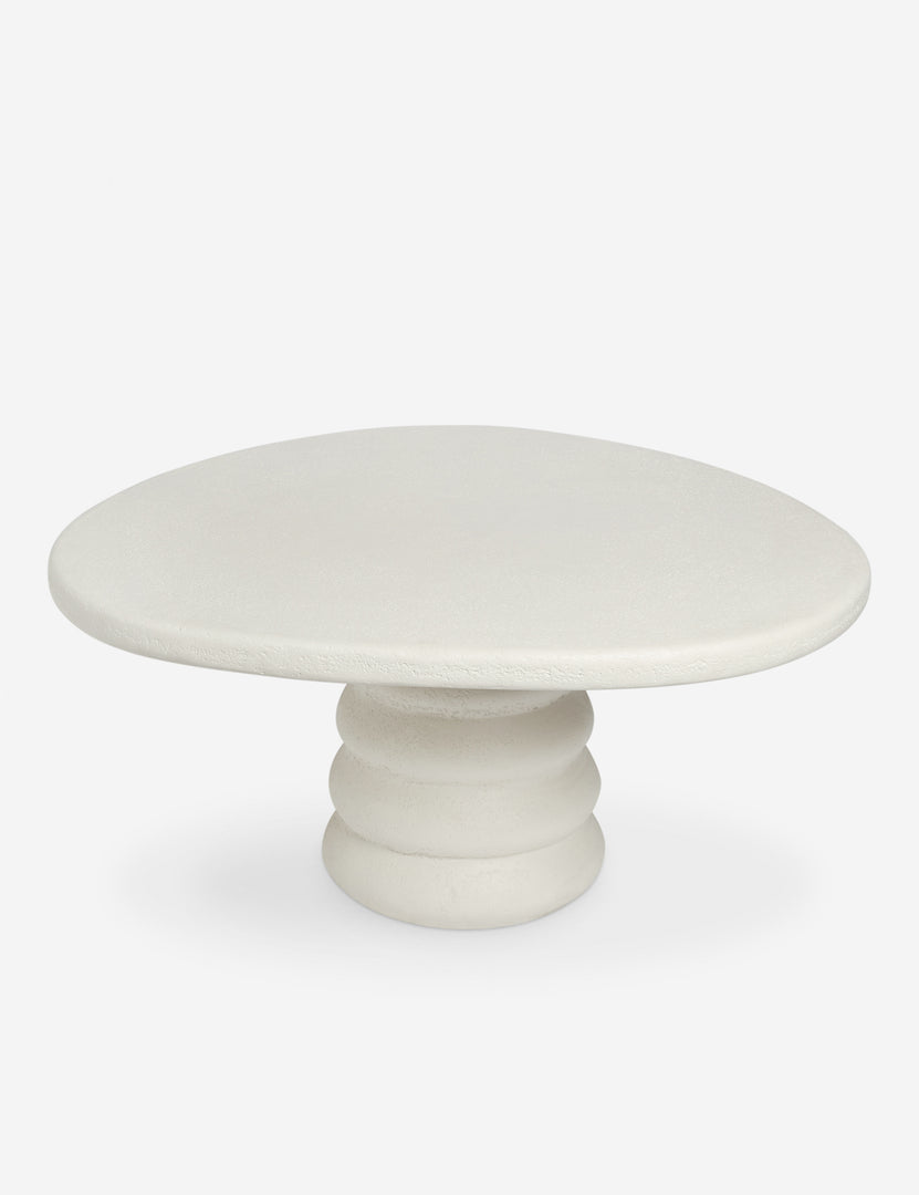 #color::ivory | Angled overhead view of the Hannu modern round fibercement dining table by Aimee Song