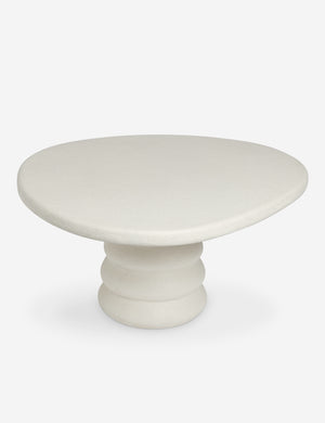 Angled overhead view of the Hannu modern round fibercement dining table by Aimee Song