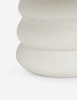 Close up view of the Hannu modern round fibercement dining table by Aimee Song