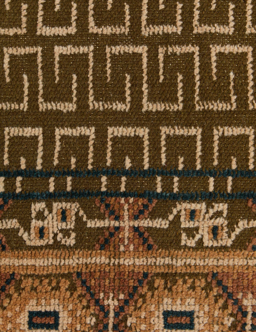 #color::ochre #size::2--x-3- #size::2-6--x-8--runner #size::3--x-5- #size::4--x-6- #size::5--x-8- #size::6--x-9- #size::8--x-10- #size::9--x-12- #size::10--x-14- #size::12--x-15- | Close up of the pattern of the Manca traditional geometric motif hand-knotted wool rug.