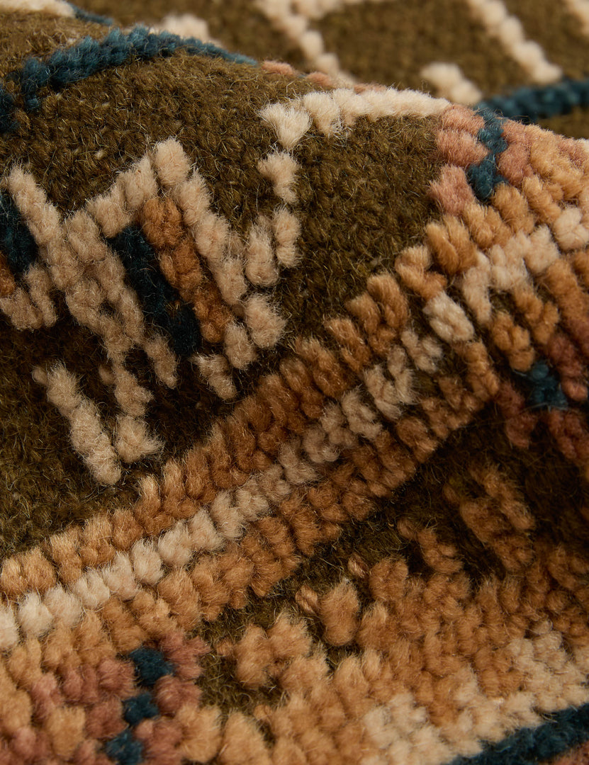 #color::ochre #size::2--x-3- #size::2-6--x-8--runner #size::3--x-5- #size::4--x-6- #size::5--x-8- #size::6--x-9- #size::8--x-10- #size::9--x-12- #size::10--x-14- #size::12--x-15- | Close up of the Manca traditional geometric motif hand-knotted wool rug.