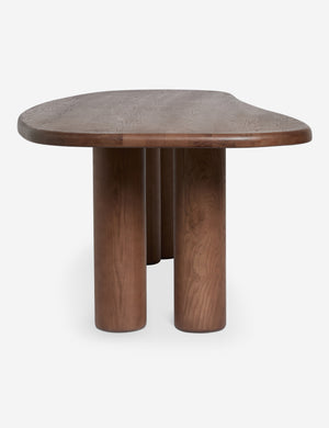 Side profile view of the Nave modern sculptural red oak dining table by Aimee Song