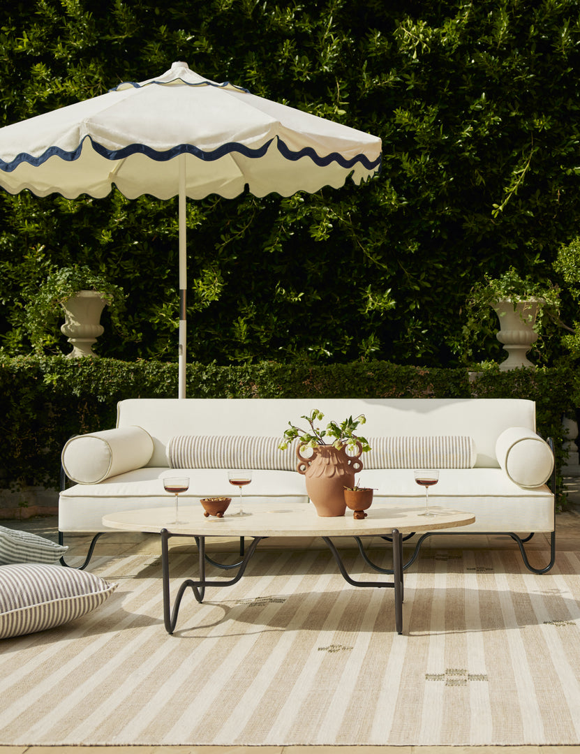 #color::brown | Littu Indoor / Outdoor Striped Bolster Pillow by Sarah Sherman Samuel in Brown styled on an outdoor sofa.