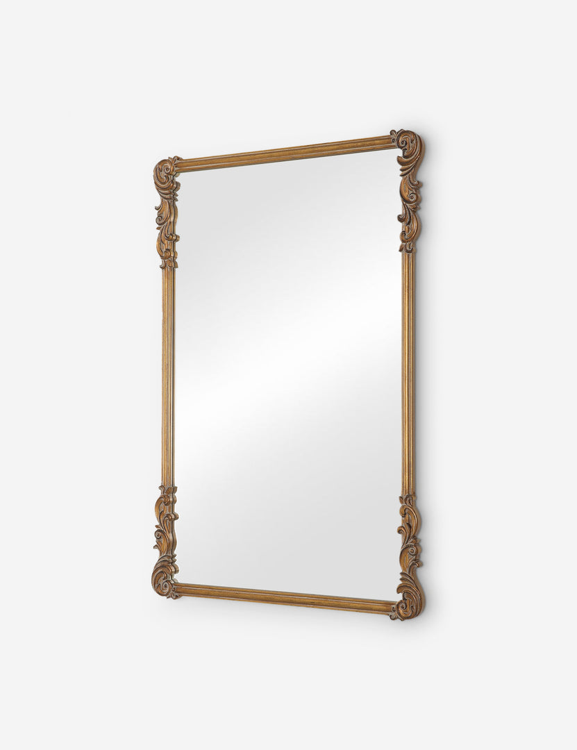#color::gold | Angled view of the Charlo ornate scroll frame wall mirror